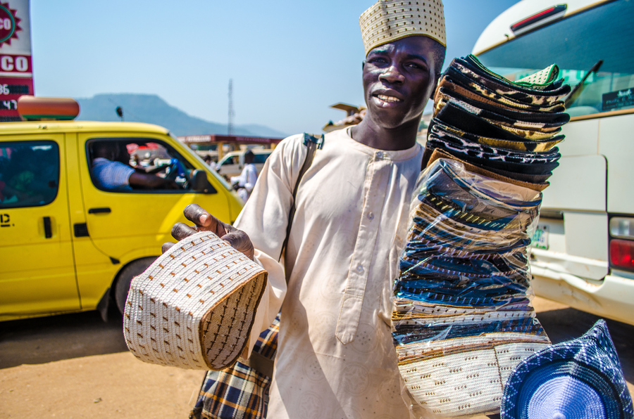 A vendor selling Hausa native caps in Lokoja, Nigeria
