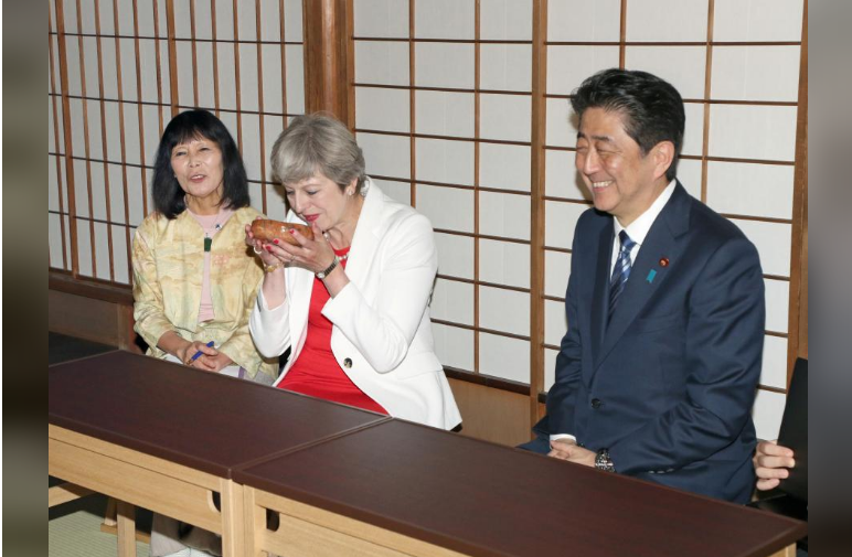 Theresa May, British Prime Minister (2nd L) takes part in a tea ceremony with Shinzo Abe, Japanese Prime Minister (R) at Omotesenke Fushin'an in Kyoto, western Japan August 30, 2017