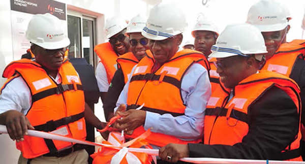 Rotimi Amaechi, Nigeria's minister of transport and Maikanti Baru, group managing director of the NNPC, while opening the Lagos Midstream Jetty (LMJ) at the Apapa Harbour in Lagos.