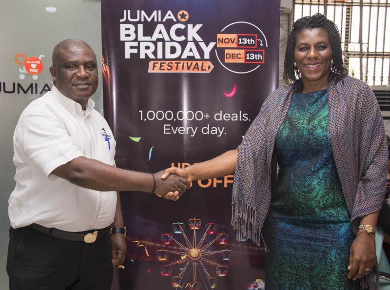 Chux Mogolu, Key Account Director, Dangote Cement, (left) in a handshake with the Chief Executive Officer of Jumia Nigeria, Juliet Anammah after the flag-off of on-line purchase dealLink: Dangote GroupLink: Dangote Cement PlcLink: Jumia Nigeria