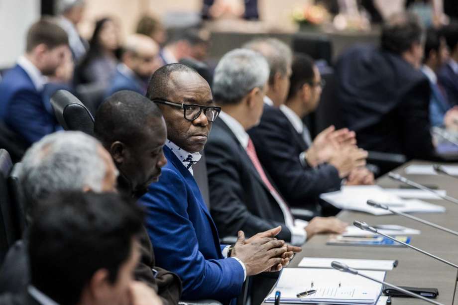Emmanuel Ibe Kachikwu, Nigeria's petroleum and resources minister, center, looks on during a news conference the 173rd Organization of Petroleum Exporting Countries (OPEC) meeting in Vienna, Austria, on Wednesday, Nov. 29, 2017. OPEC and Russia are said to have agreed they should extend oil-supply cuts deeper into next year, but Moscow wants clarity on an exit strategy before giving formal consent.