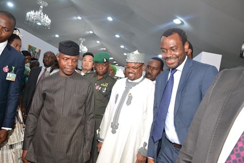 Abubakar Suleiman, then as Executive Director, Sterling Bank Plc., with Yemi Osinbajo, Nigeria's Vice President and Managing Director/CEO, Federal Housing Authority, Mohammed Al-Amin, during an exhibition by the International Federation of Interior Architects/Designers, sponsored by Sterling Bank, in Lagos
