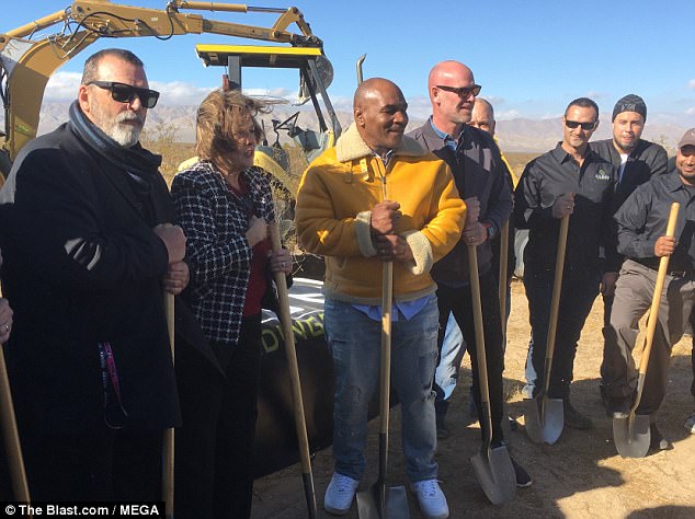 Former boxing heavyweight champion Mike Tyson (center) broke ground on December 20 on a facility in the California desert that will grow 'high-quality' marijuana