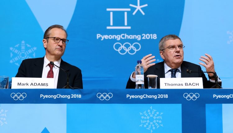 International Olympic Committee president Thomas Bach (R) addresses during a press conference held at Main Press Centre of 2018