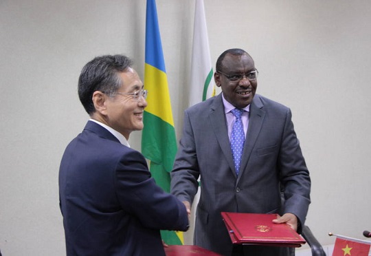 Claver Gatete, Rwanda's minister of finance and economic planning and RAO Hongwei, Chinese ambassador to Rwanda