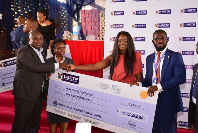 Akinwunmi Ambode, Lagos State Governor,  presenting cheques worth over N1billion to about 705 beneficiaries of the Lagos State Employment Trust Fund (ETF) pilot scheme. 