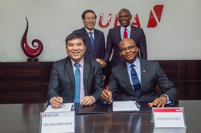 Sitting from Left: Jin Tao, Director General, Global Cooperation Department – Americas and Africa, China Development Bank (CDB); and Kennedy Uzoka GMD/CEO UBA Plc, signing a $100 million loan facility agreement to fund SMEs in Africa. Standing behind are Zheng Zhijie, President of CDB; and Tony Elumelu, Chairman of UBA Plc, at the UBA House in Lagos on Tuesday