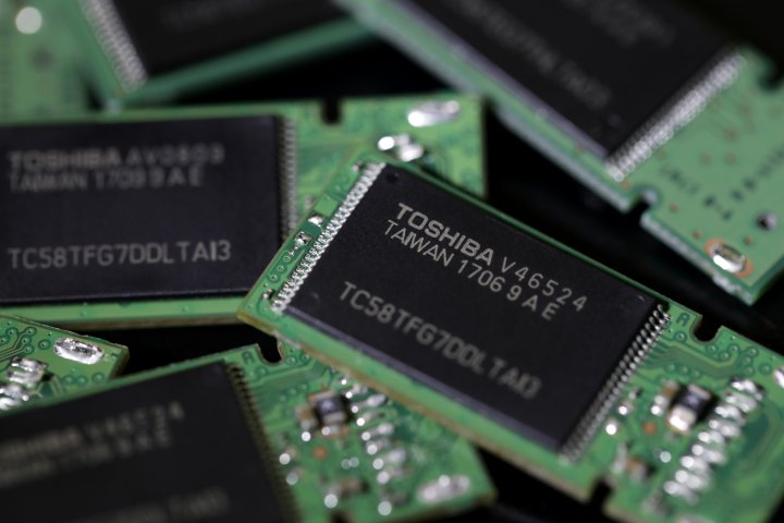 Toshiba Corp. memory chips are seen on memory modules in an arranged photograph in Tokyo, Japan, on Thursday, Aug. 17, 2017. Under pressure from its banks, Toshiba is racing to resolve several final disagreements with Western Digital Corp. before it can complete a deal to sell its chips business to the U.S. company and other investors by the end of August, according to people familiar with the matter.